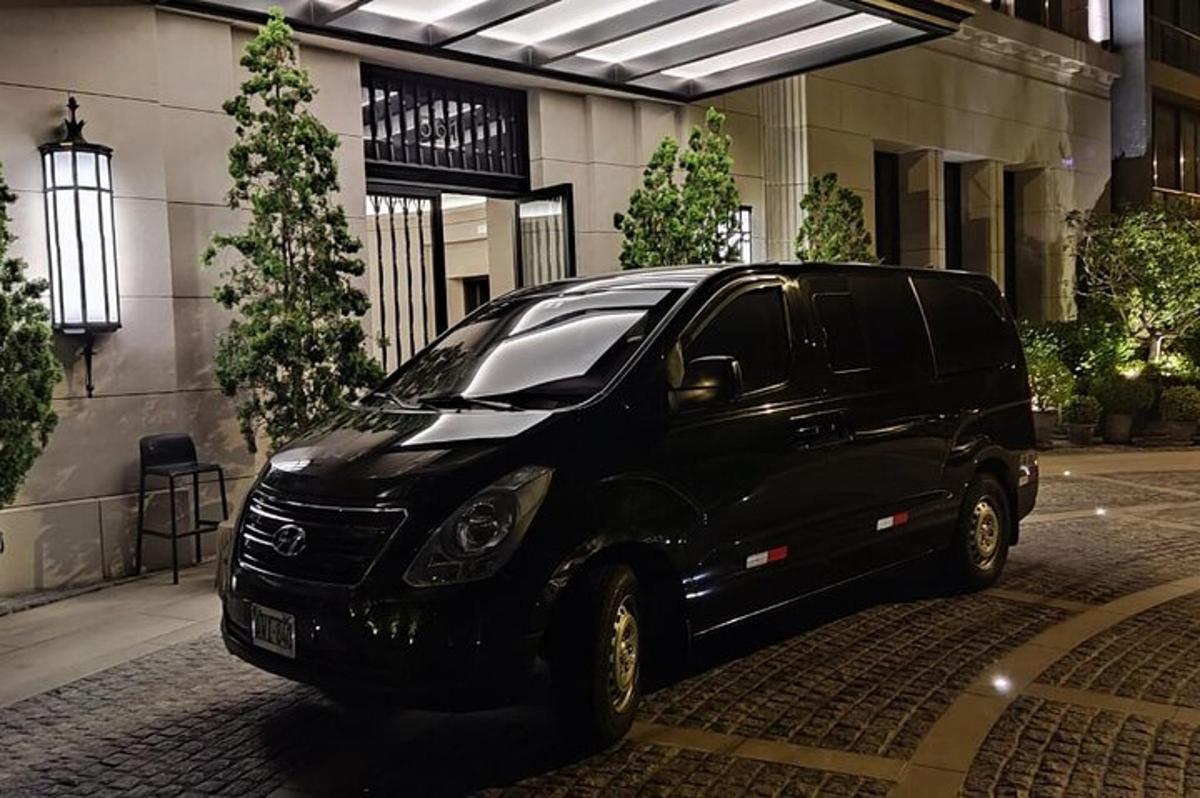 a black suv parked in front of a building