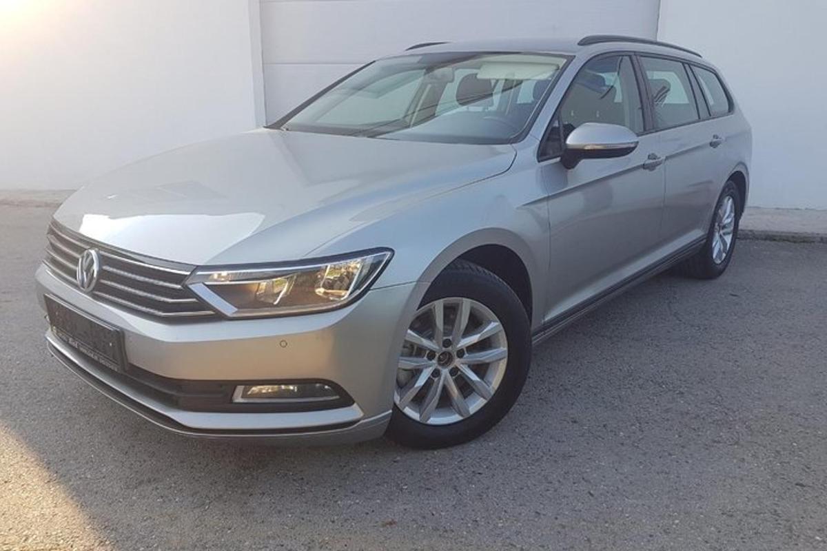 a silver car parked in a parking lot