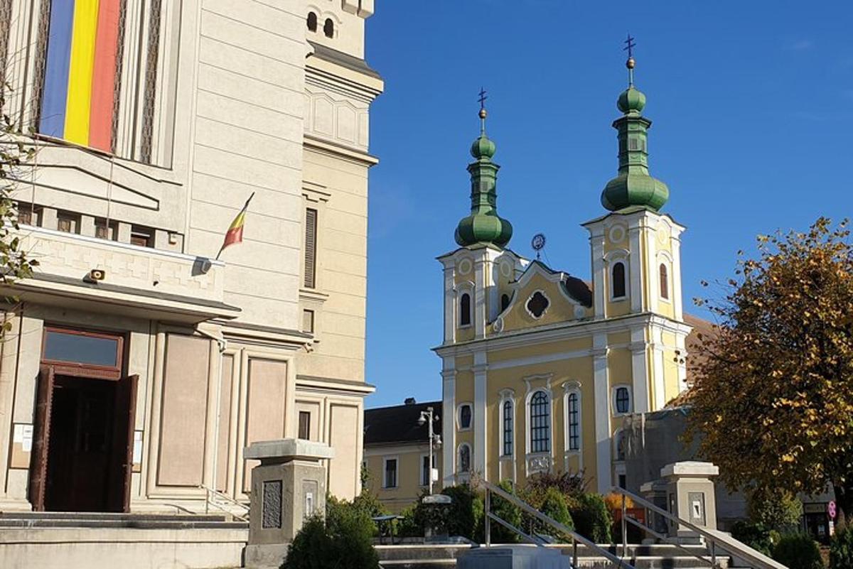 two buildings with green domes on top of them