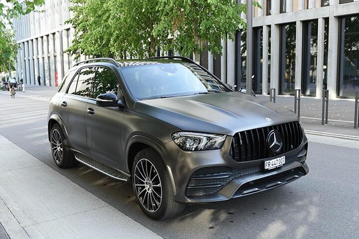 a silver car parked on the side of a street
