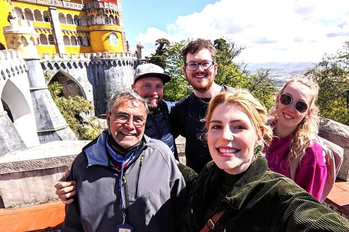 a group of people standing in front of a castle