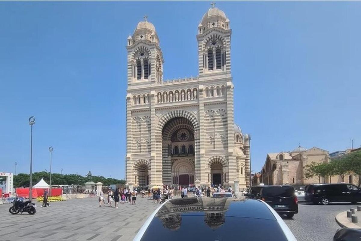 a large building with a clock tower in front of it