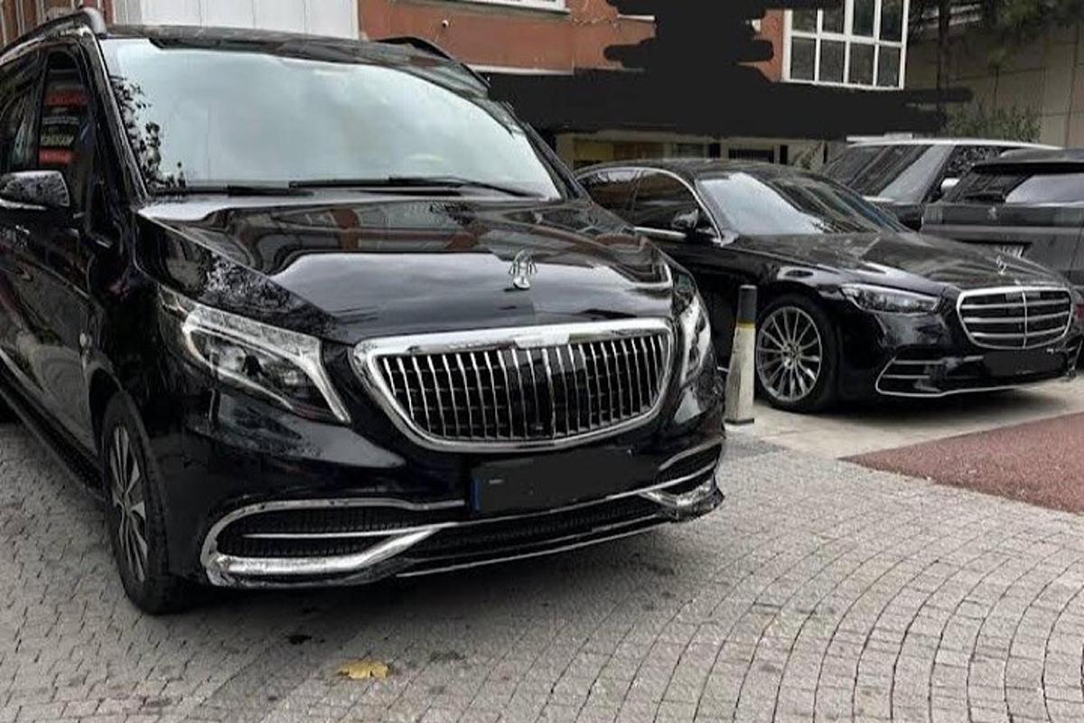 a black limousine parked in a parking lot