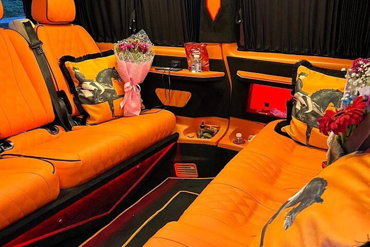 two orange seats in a train room