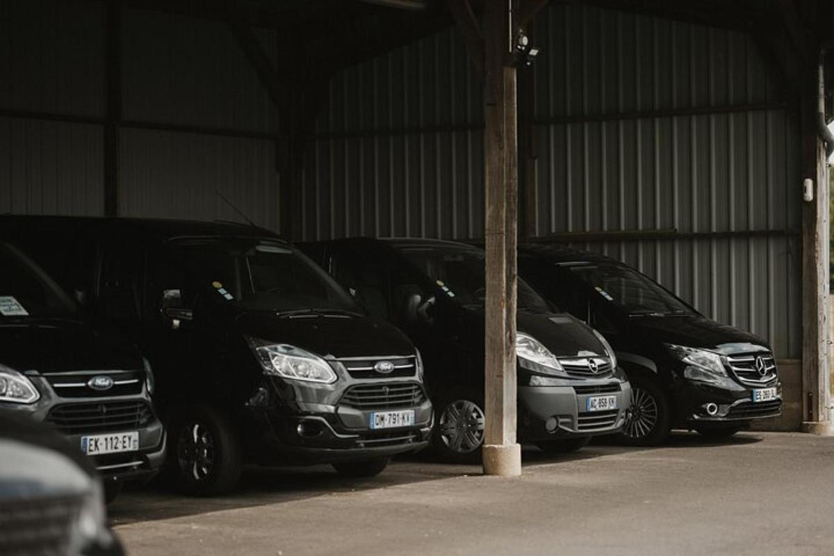 a row of parked cars parked in a garage
