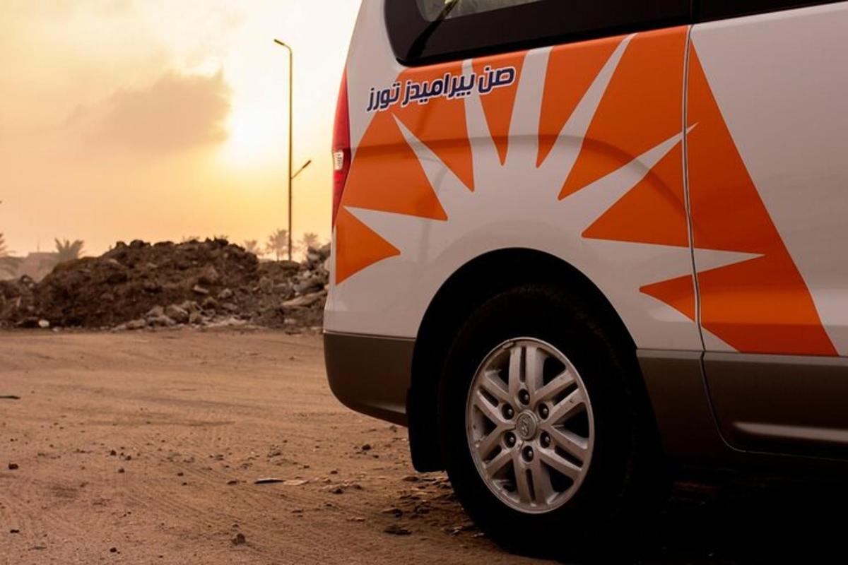 a van parked on the side of a dirt road