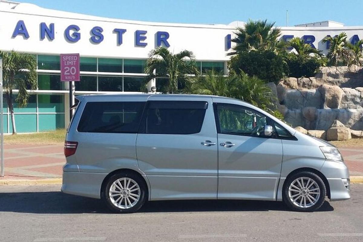 a silver van is parked in a parking lot