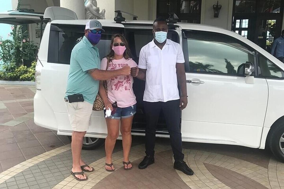 a group of three people standing in front of a van