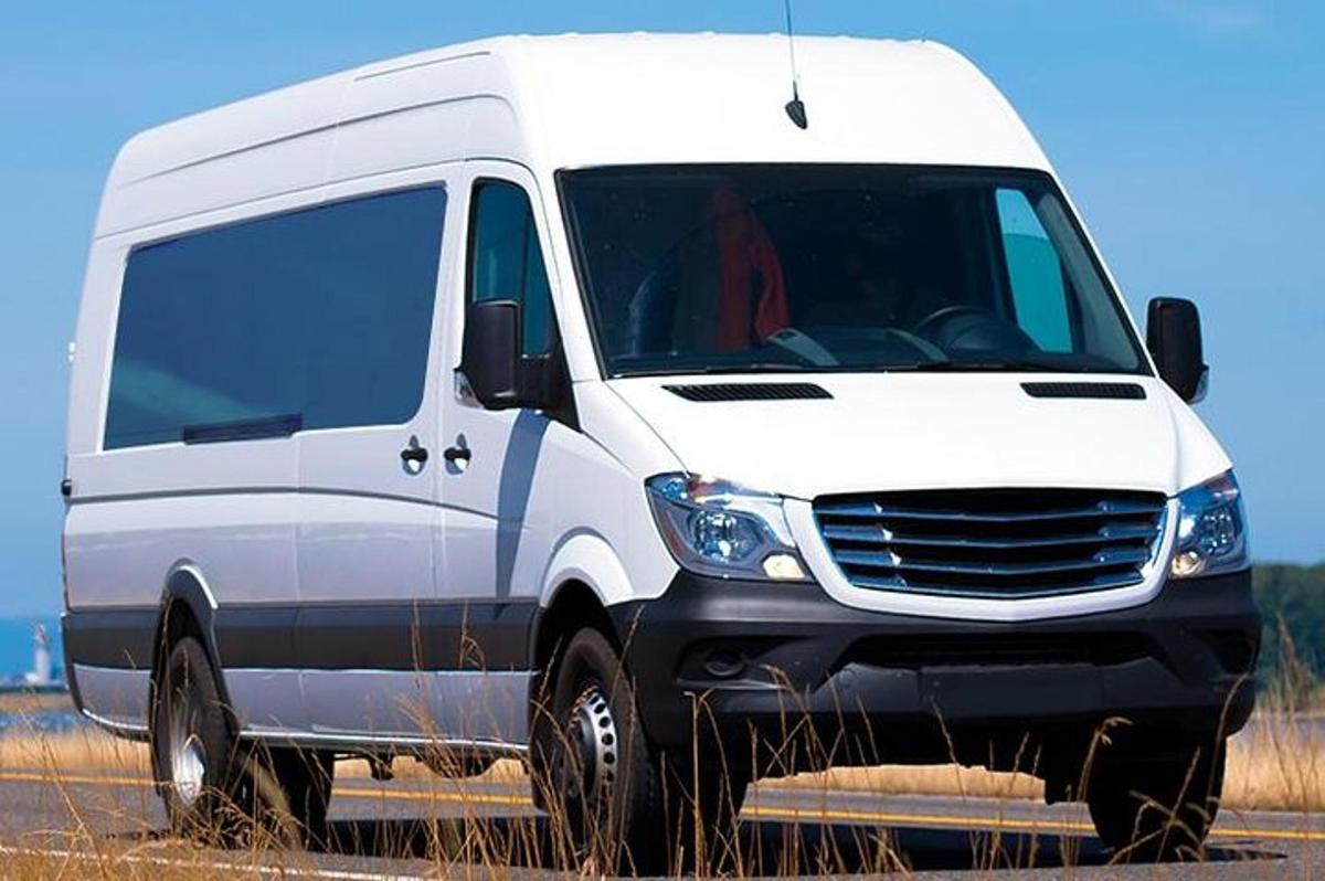 a white van is parked on a road