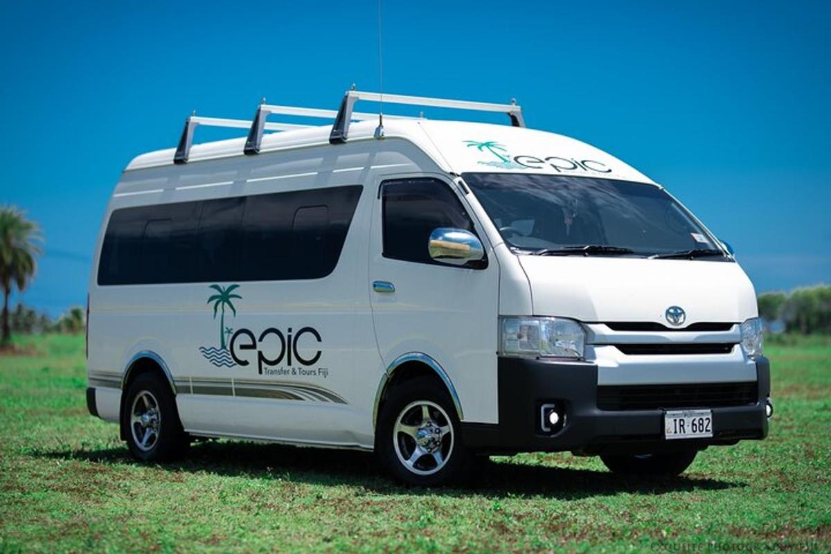 a white van parked in a grass field