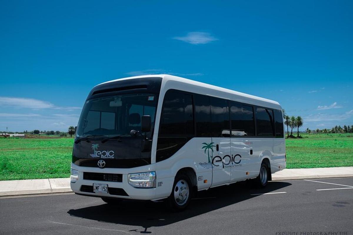a white bus parked in a parking lot