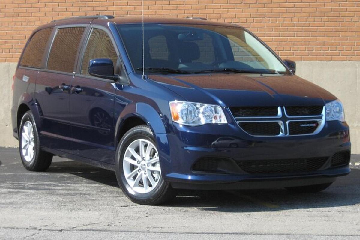 a blue suv parked in a parking lot