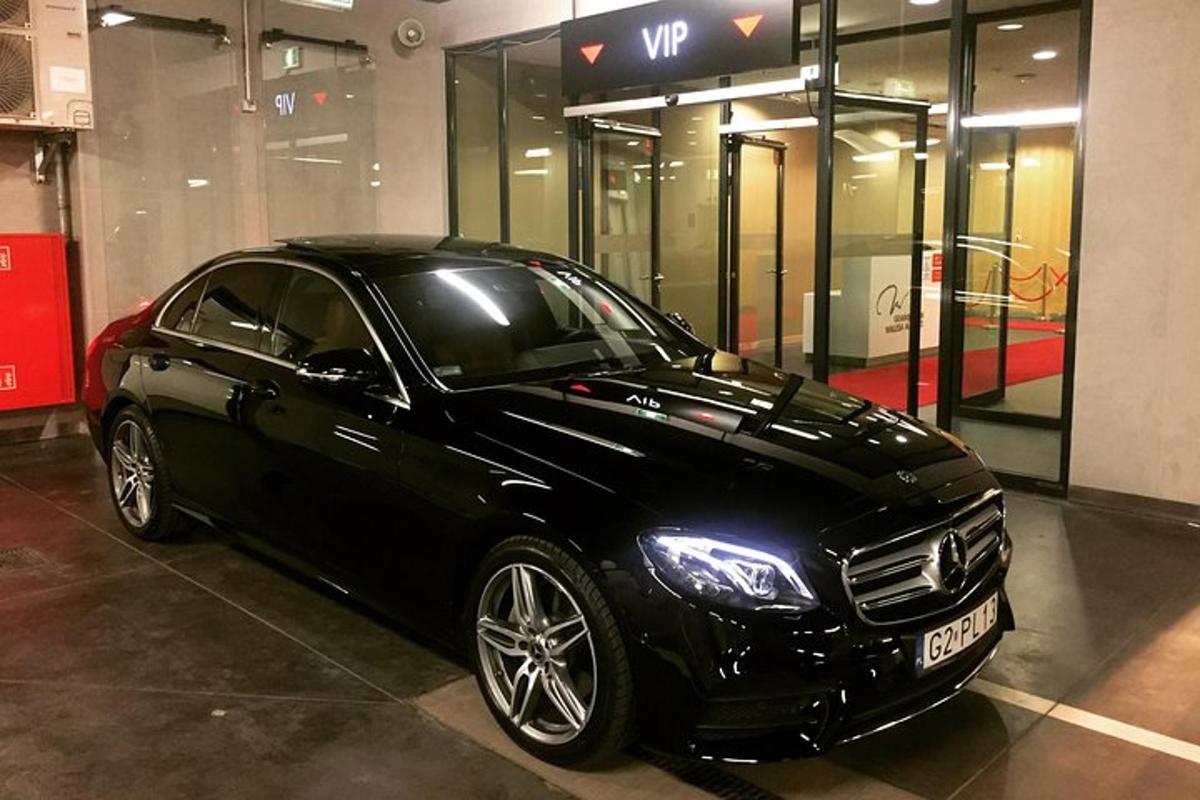 a black car parked in front of a building