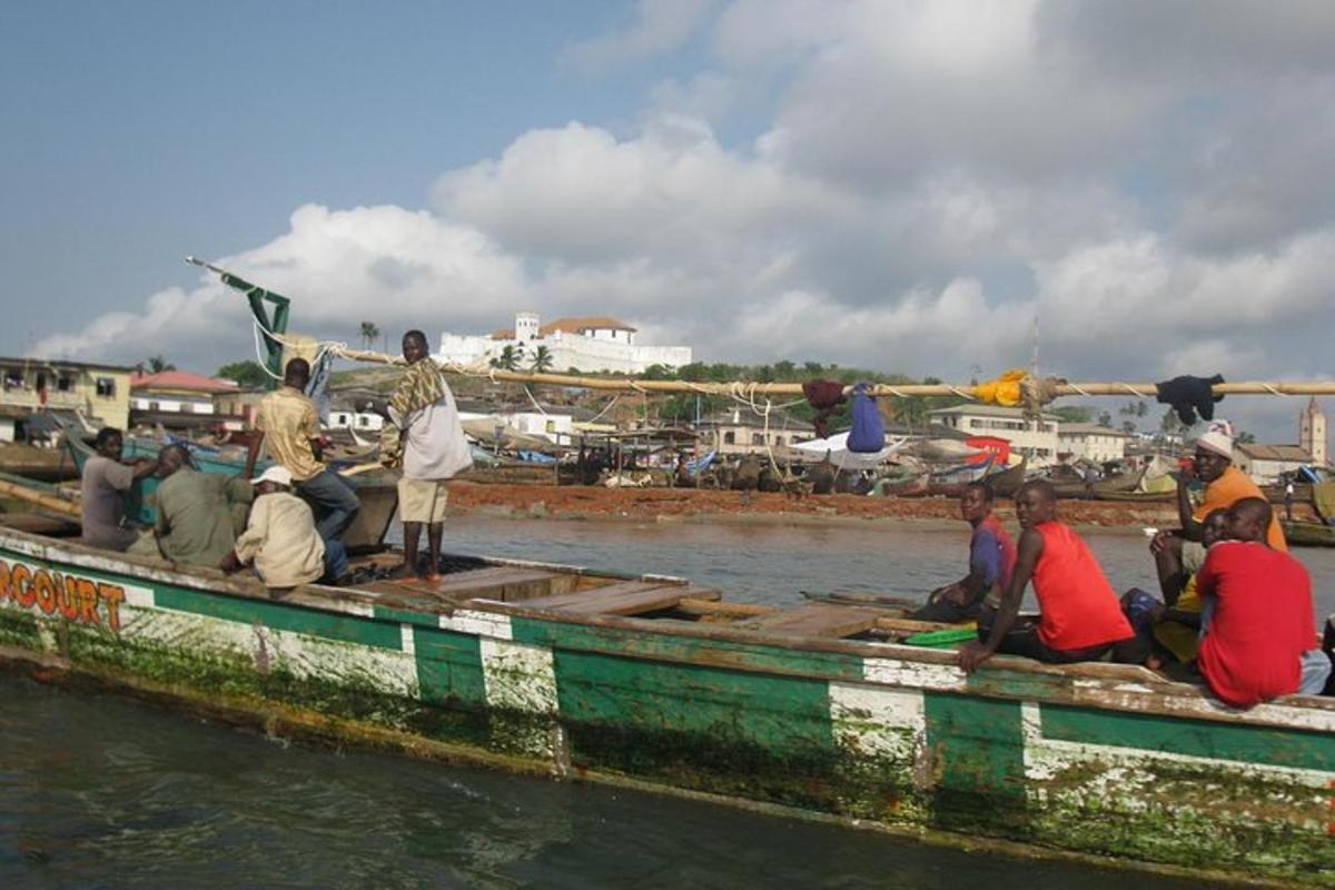 a group of people sitting on a boat in the water