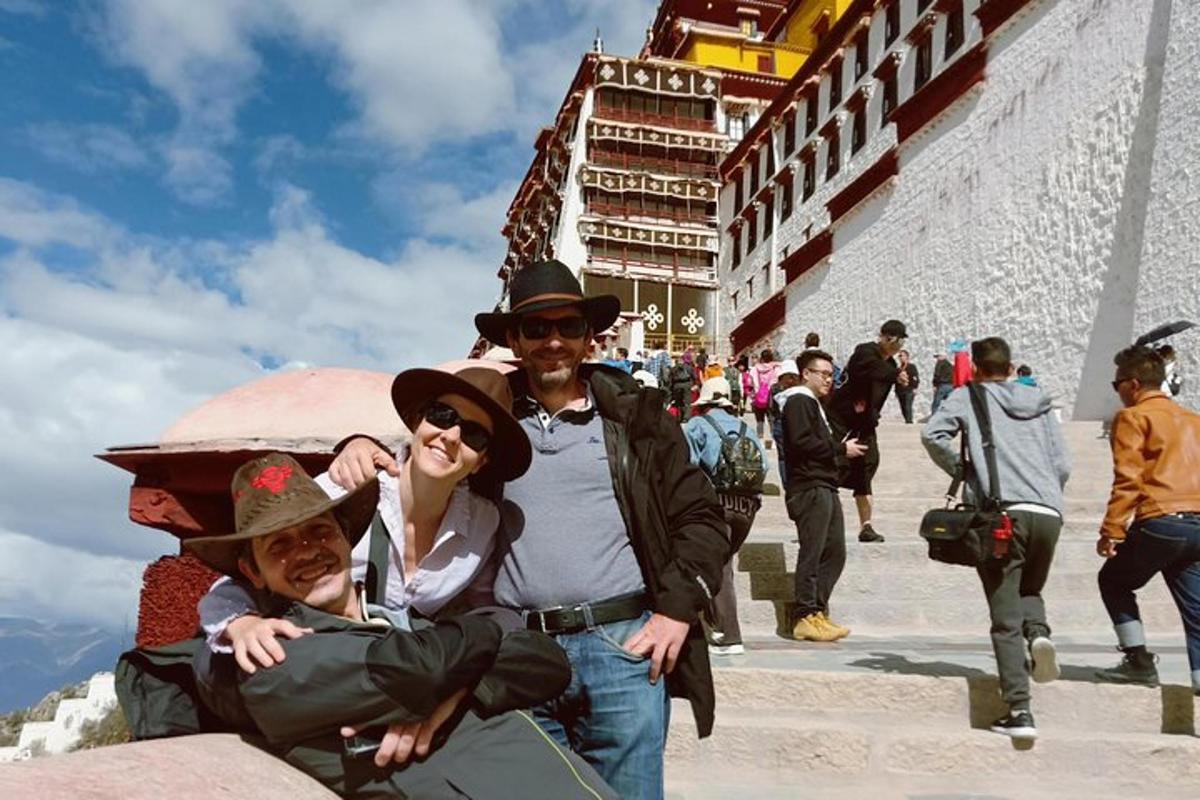 a group of people posing for a picture on the stairs