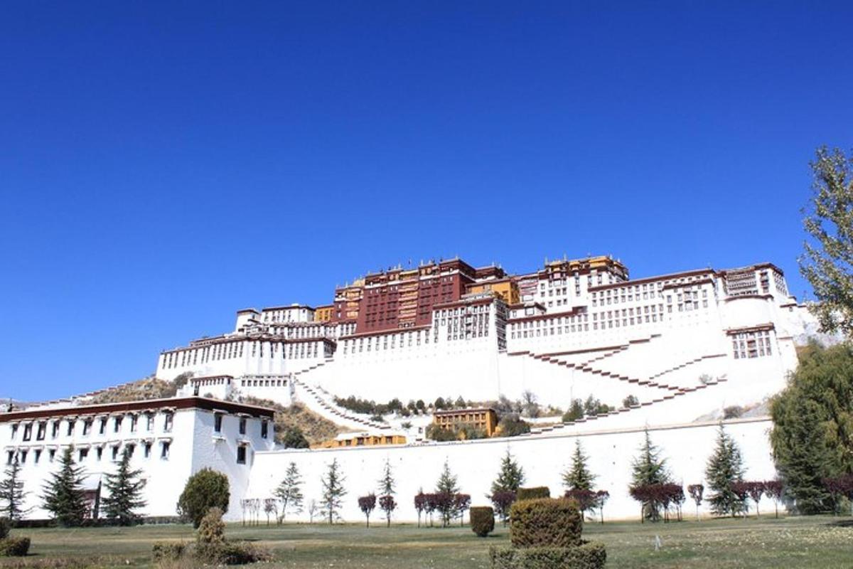 a large white building on top of a hill