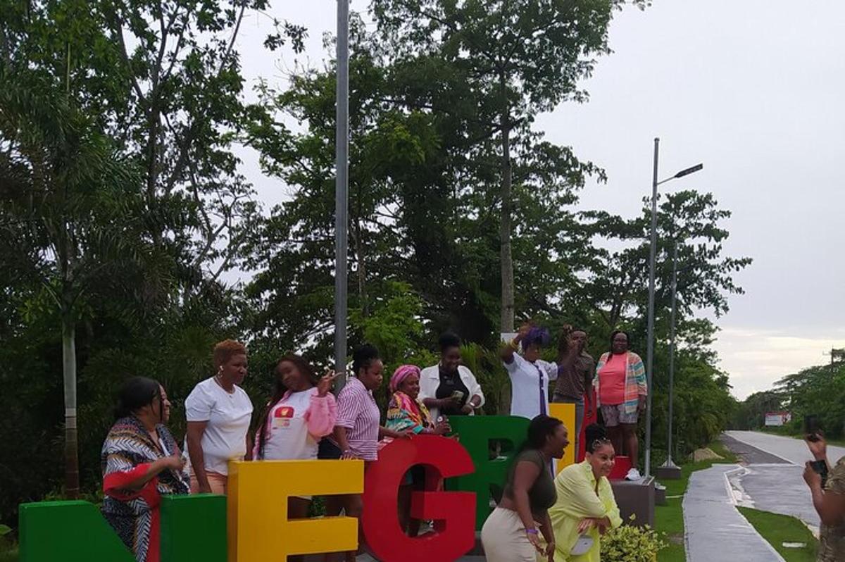 a group of people standing behind a sign that reads fed