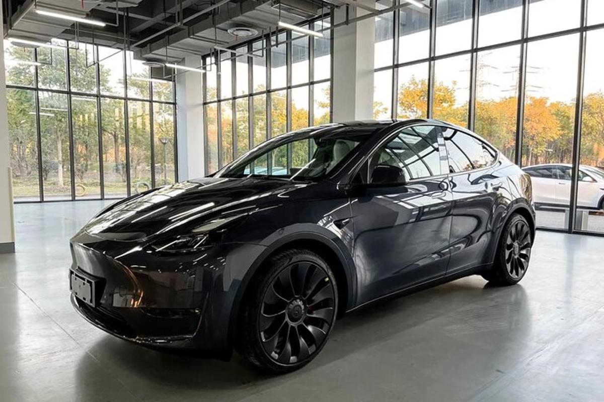 a black car parked in a building with windows