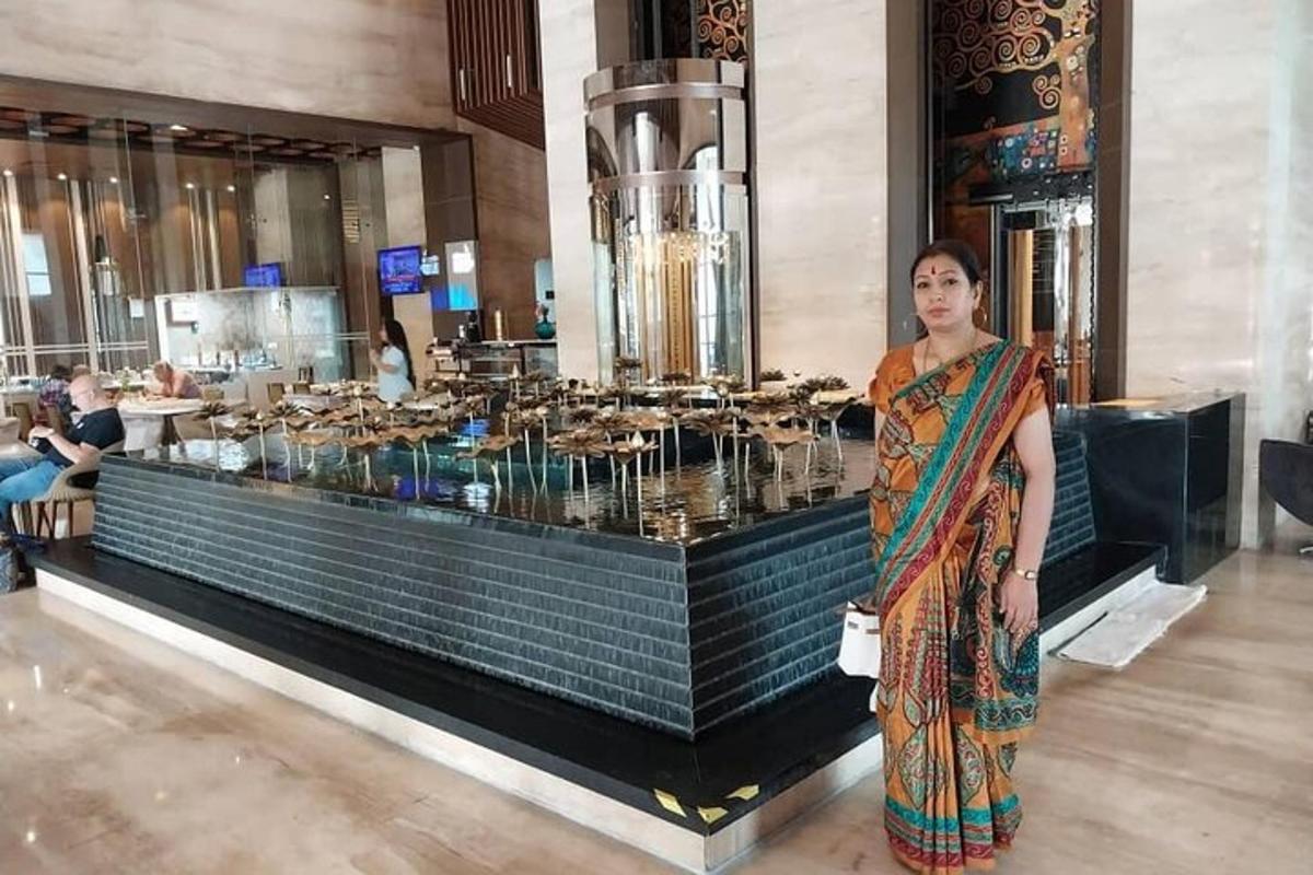 a woman standing in front of a buffet of food