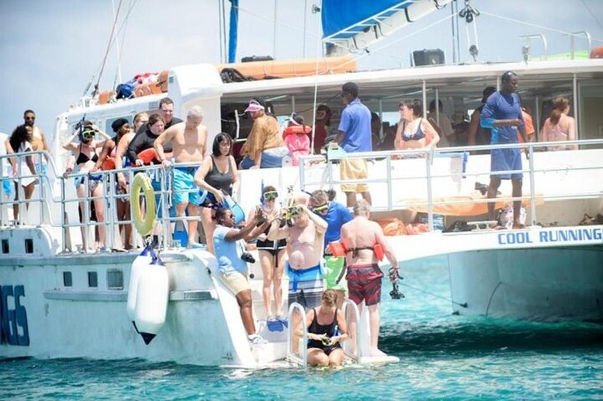 a group of people on a boat in the water