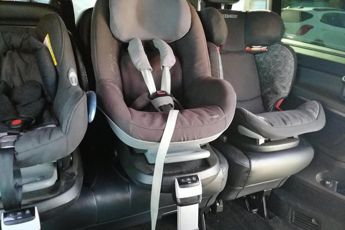 two baby seats in the back of a car