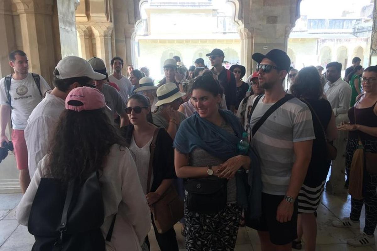 a group of people standing in a crowd in a building
