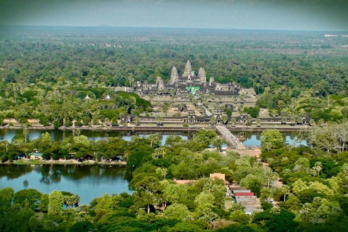 an aerial view of a temple and a lake
