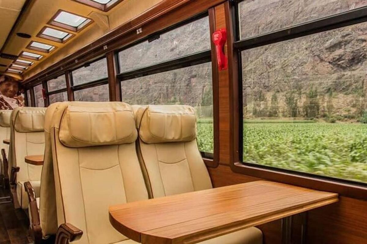 a dining car of a train with a table and a window