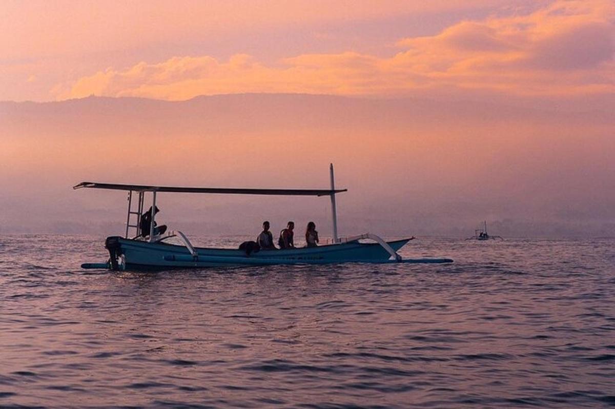 a group of people on a boat in the water