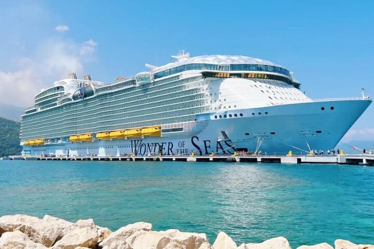 a cruise ship is docked at a dock
