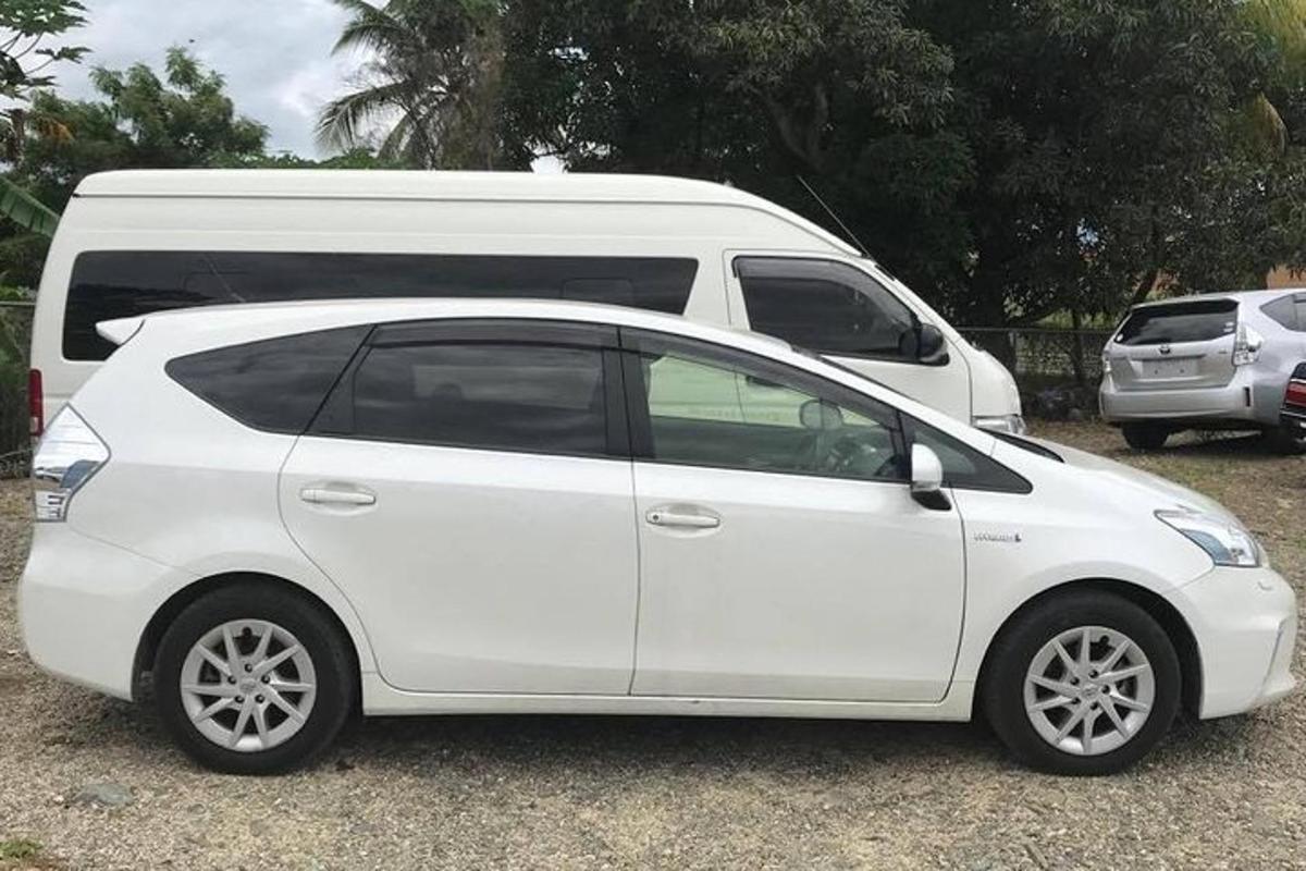 a white car parked next to a white van