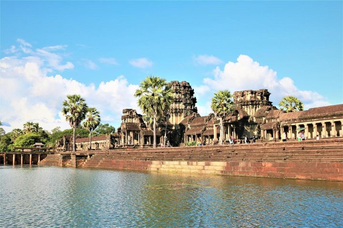 a view of a temple next to a body of water