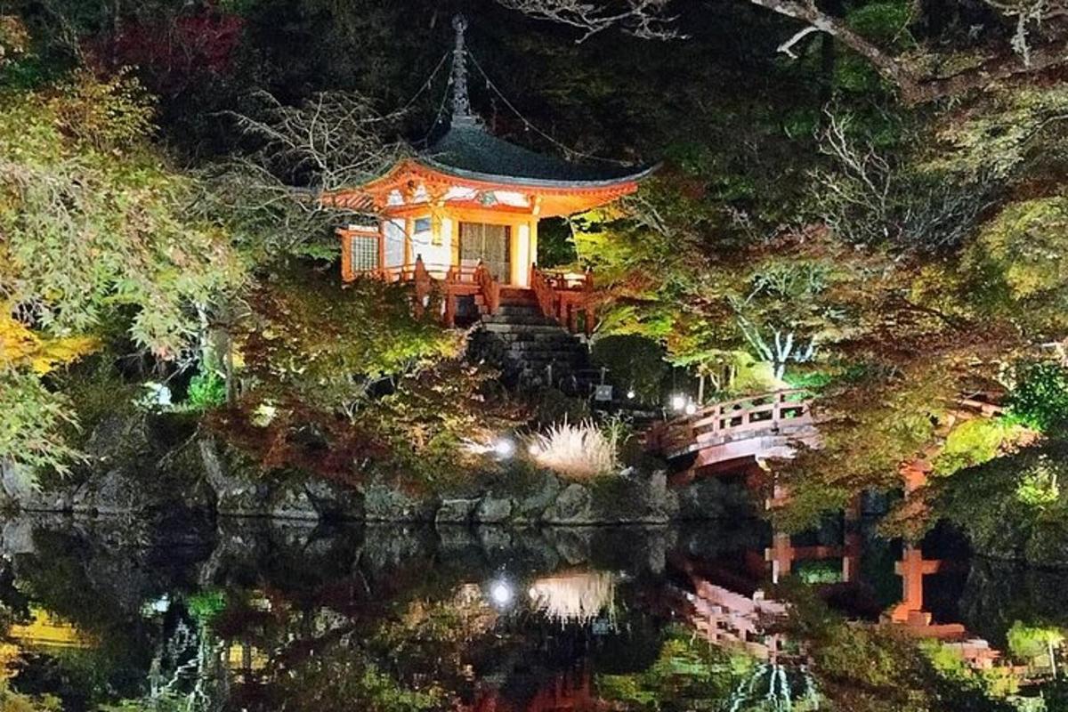a chinese house on the side of a river at night