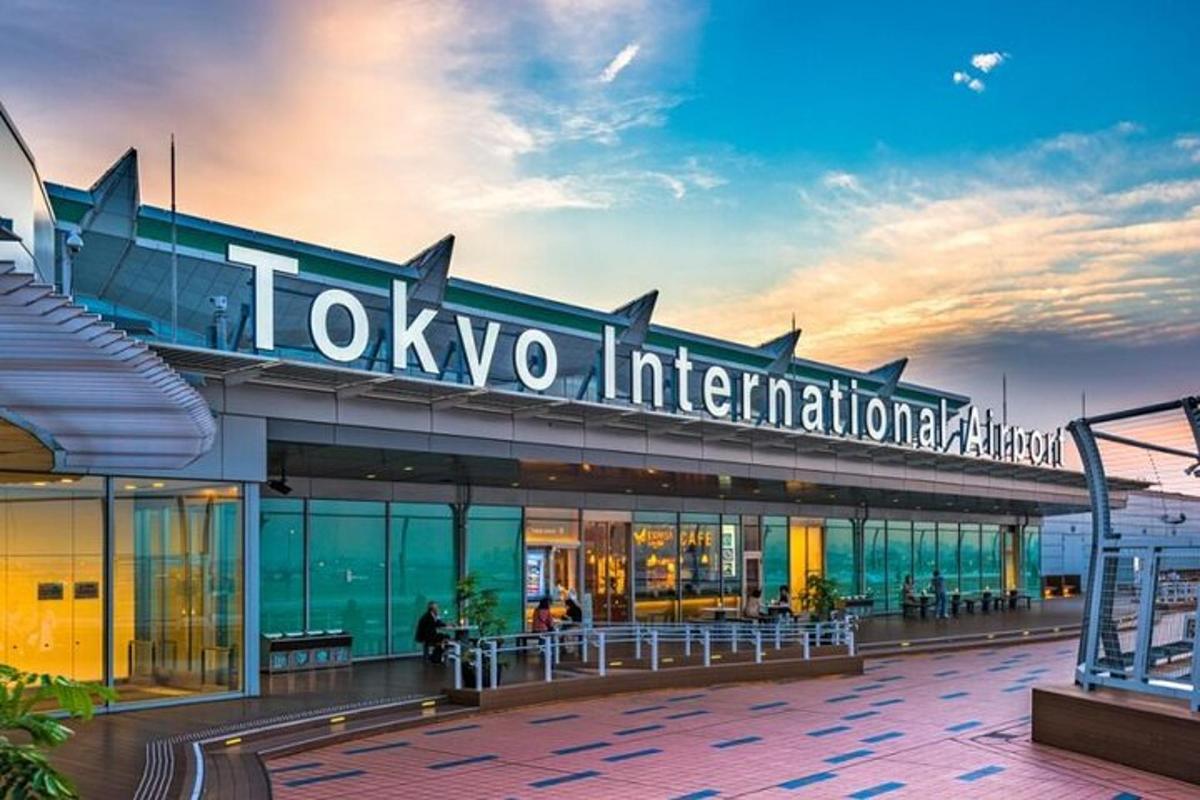 a tokyo international sign on top of a building