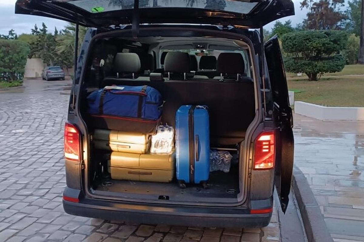 a suv with its trunk open with luggage in it
