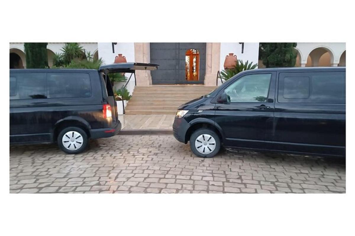 two black vans parked next to each other