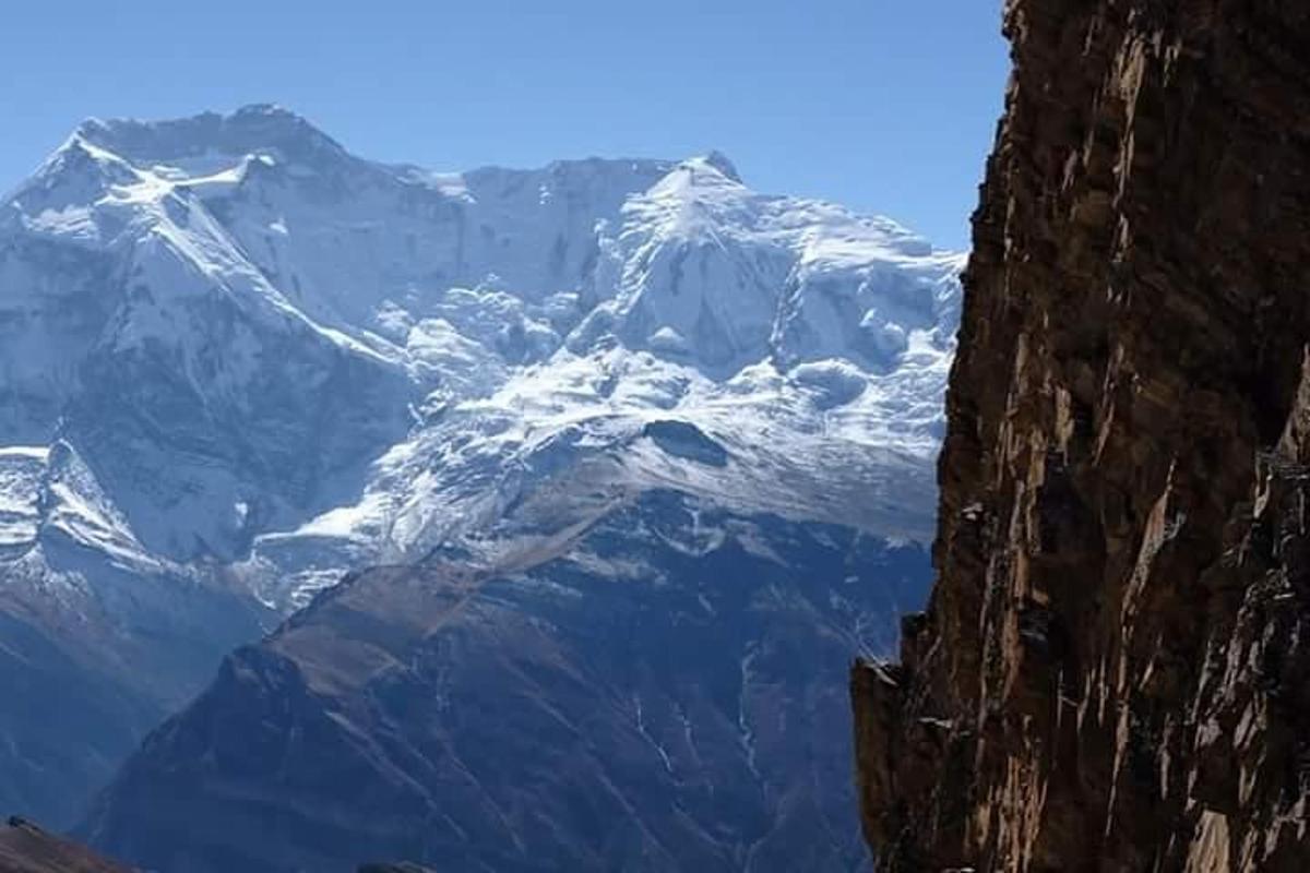 a snow covered mountain in the distance with