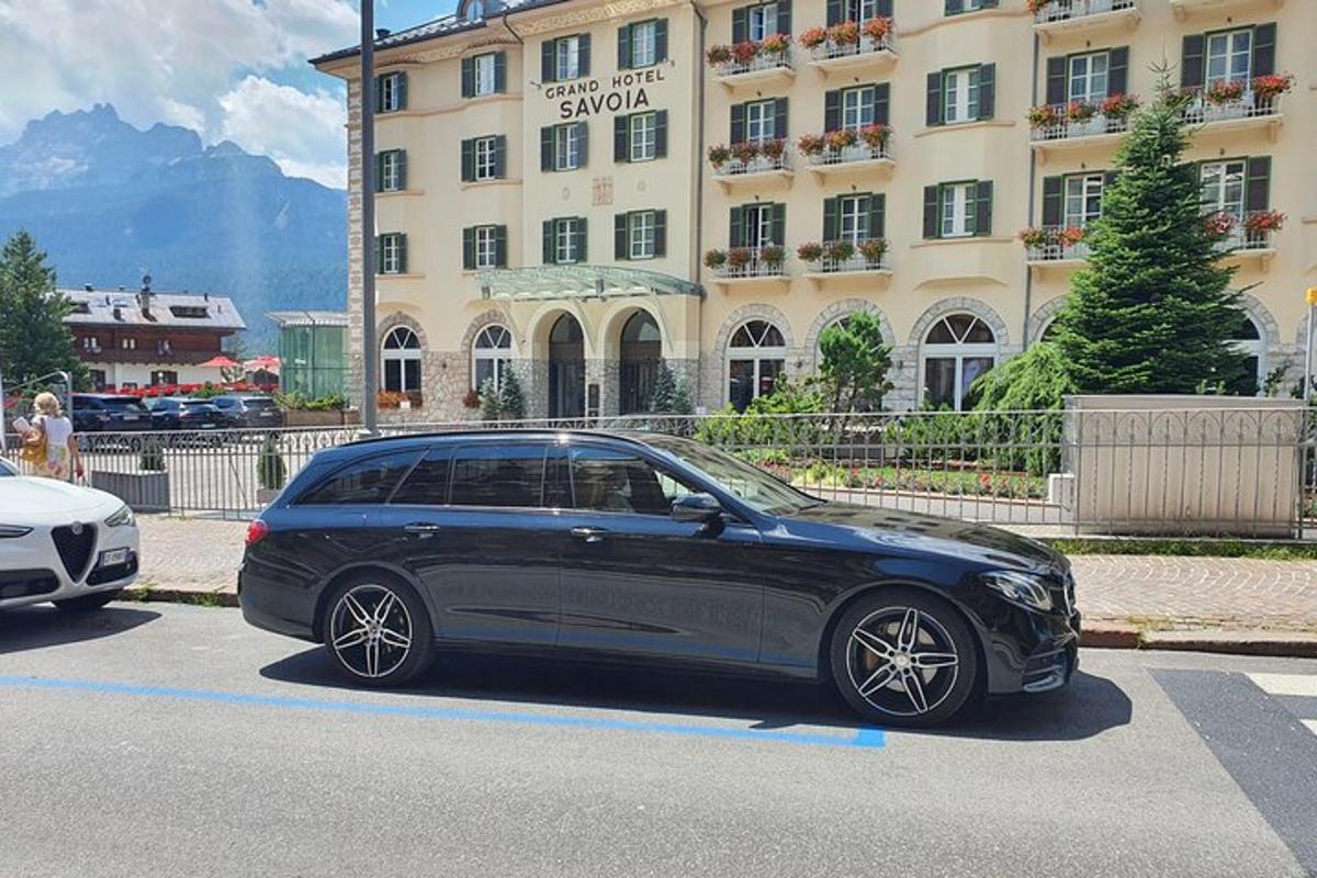 a black car parked in front of a building