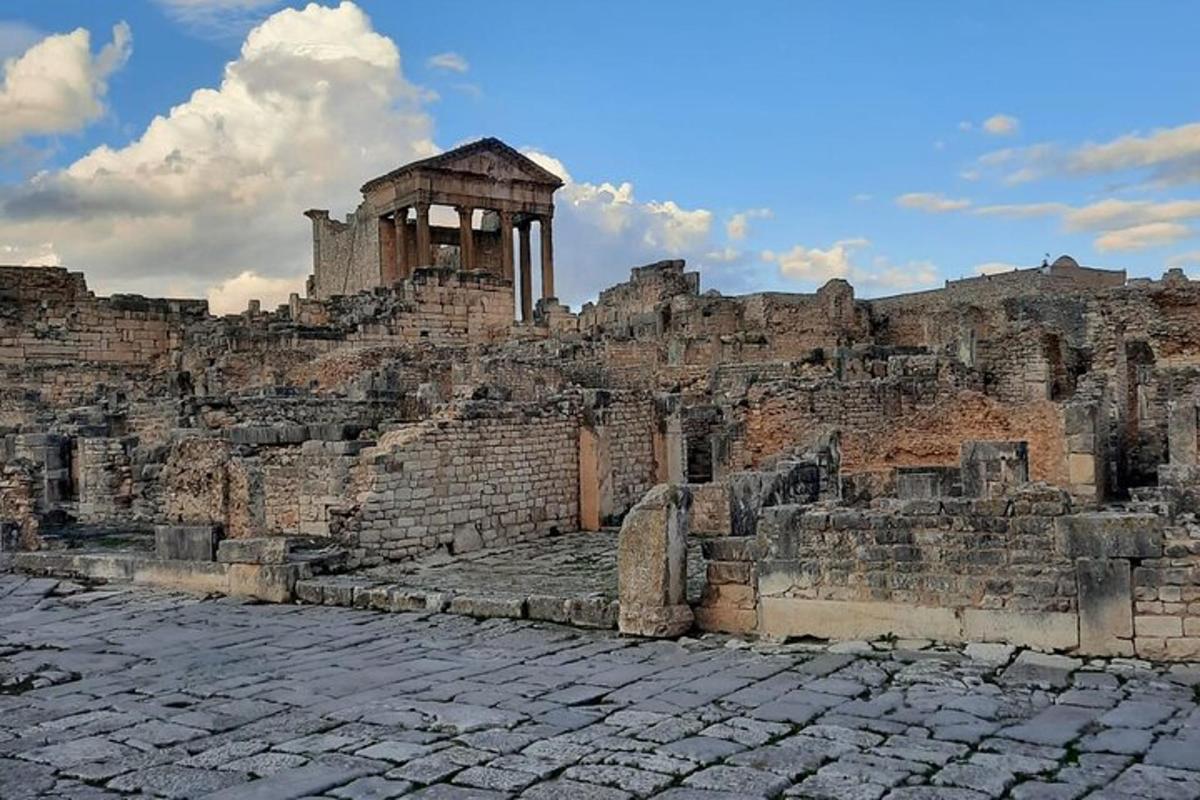 an ancientiseum with a building on top of it