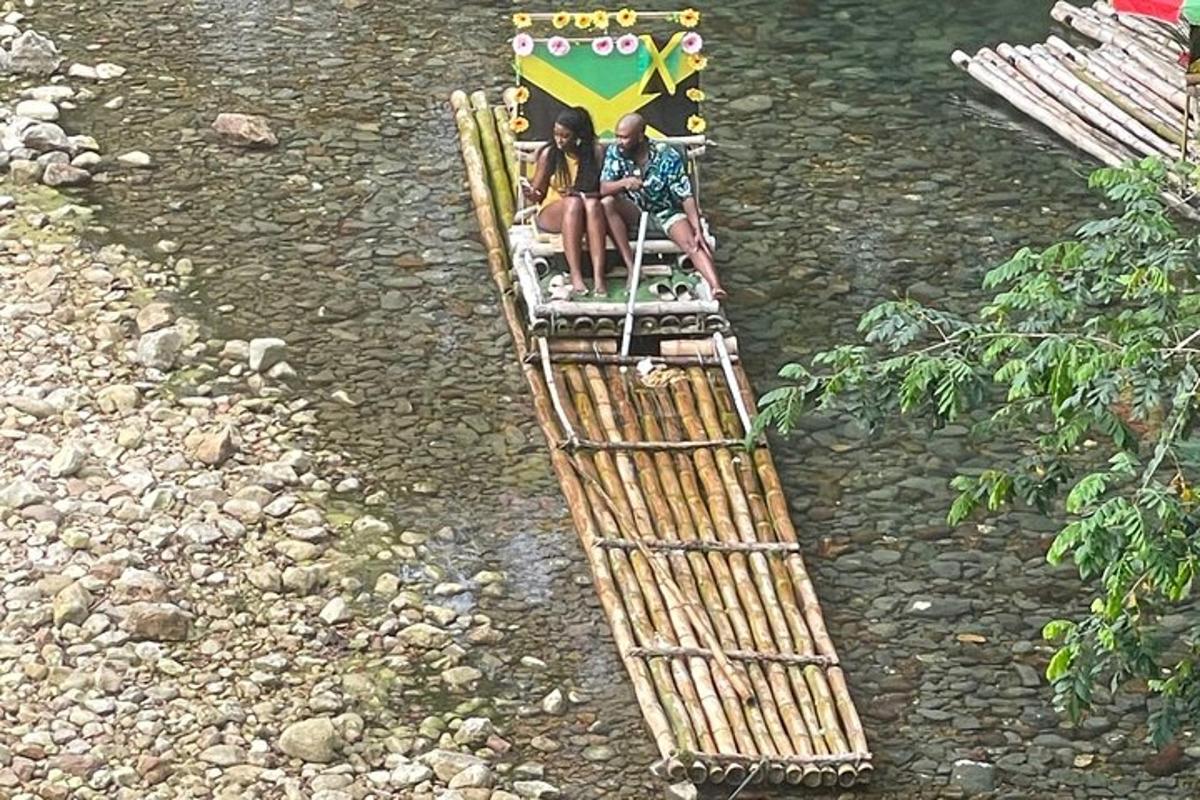 two people sitting on a raft in a river