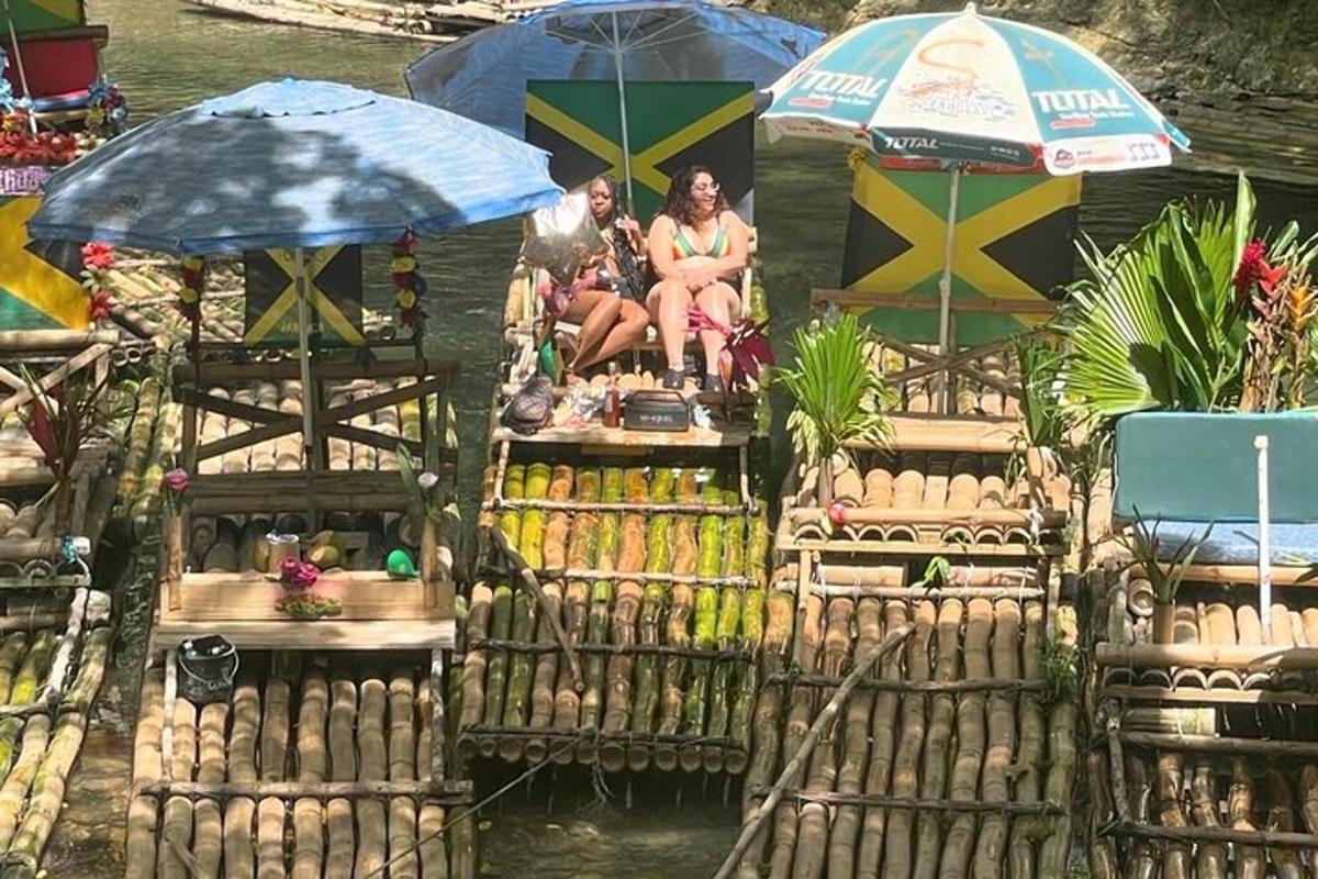 a group of people sitting on a raft in the water with umbrellas