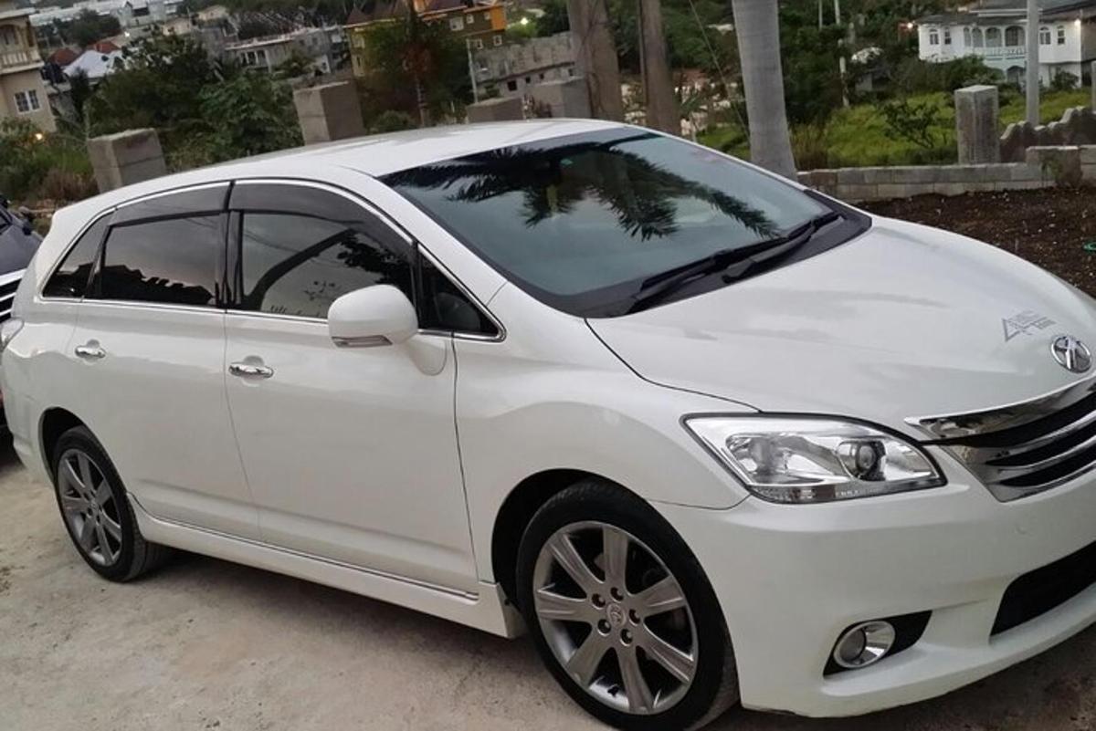 a white car parked in a parking lot