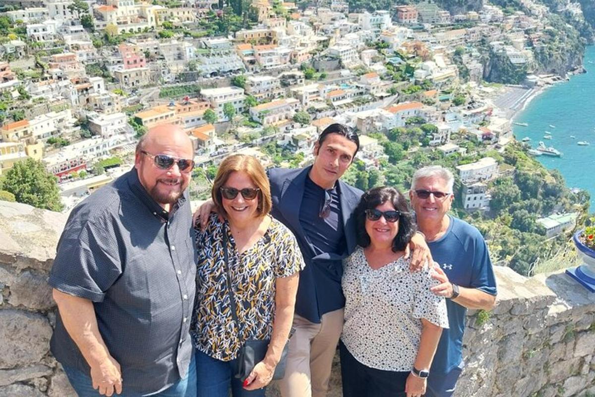 a group of people standing on top of a mountain
