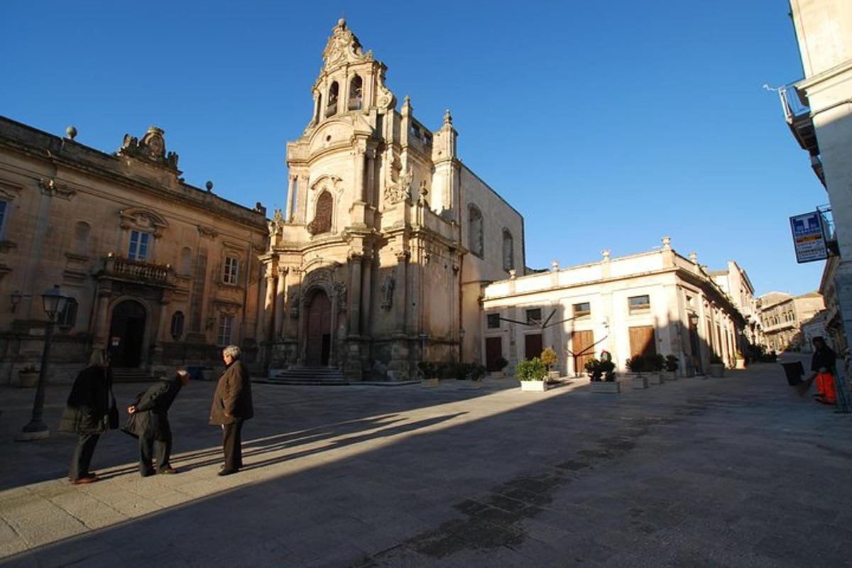 a group of people standing in front of a church