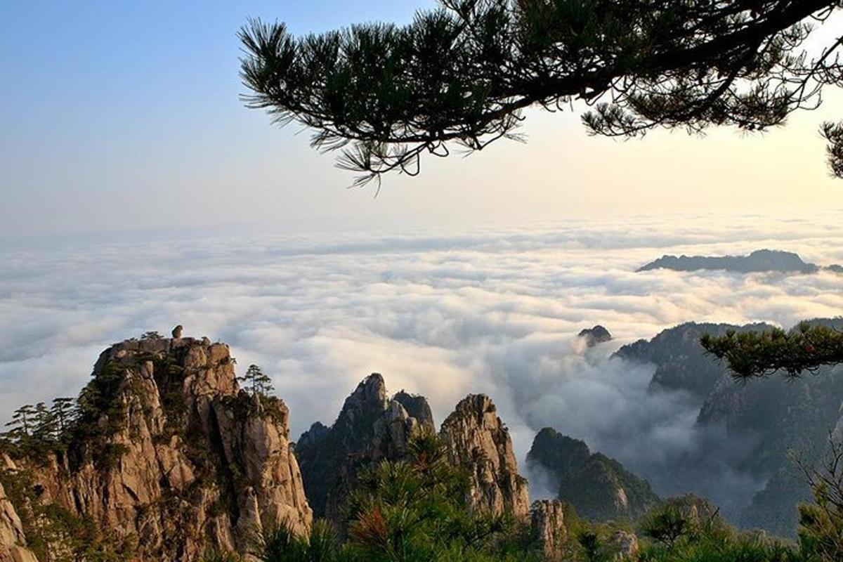 a view of a mountain range with clouds