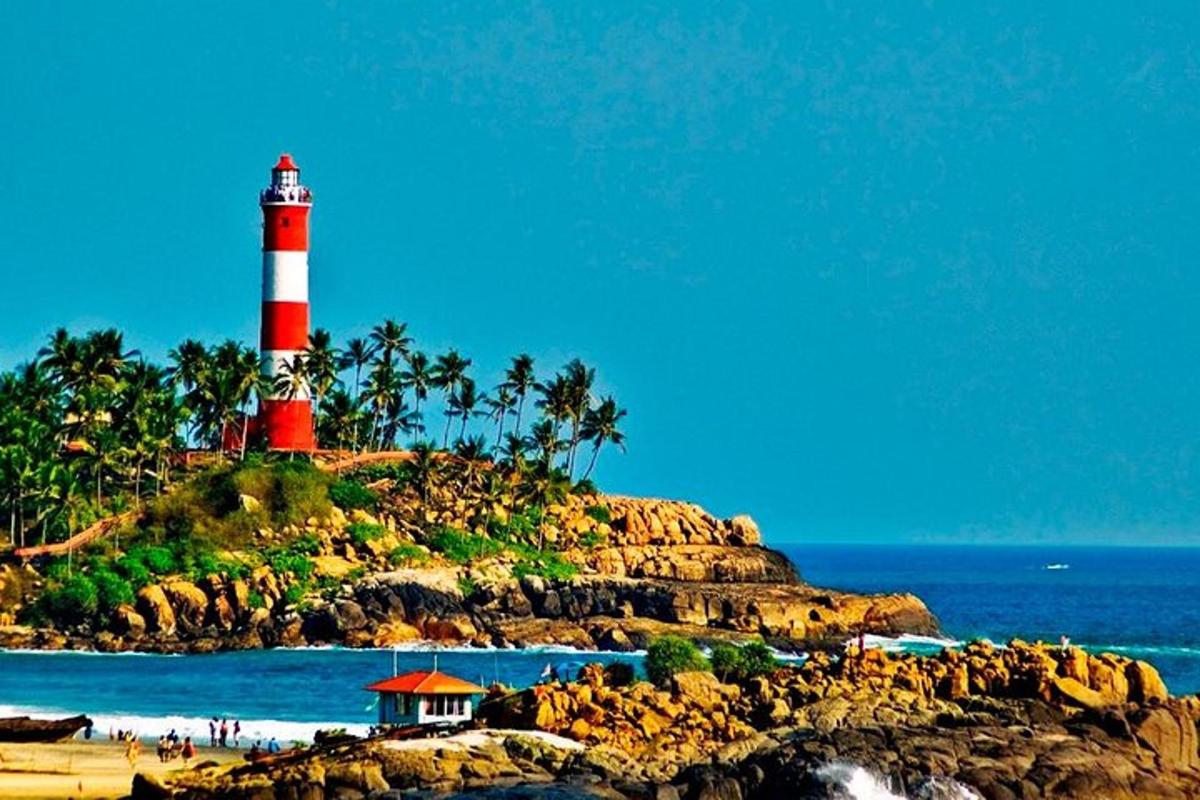 a red and white lighthouse on an island in the ocean