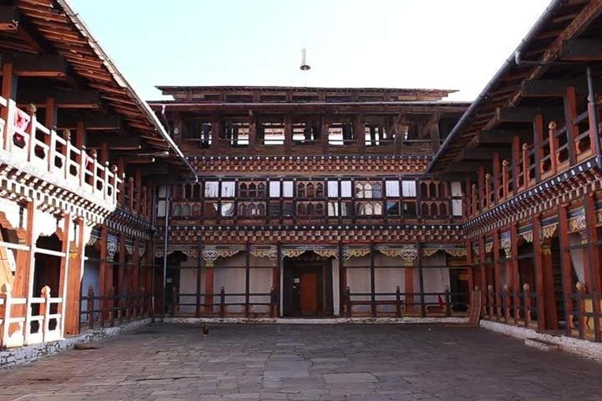 a large building with a courtyard in front of it