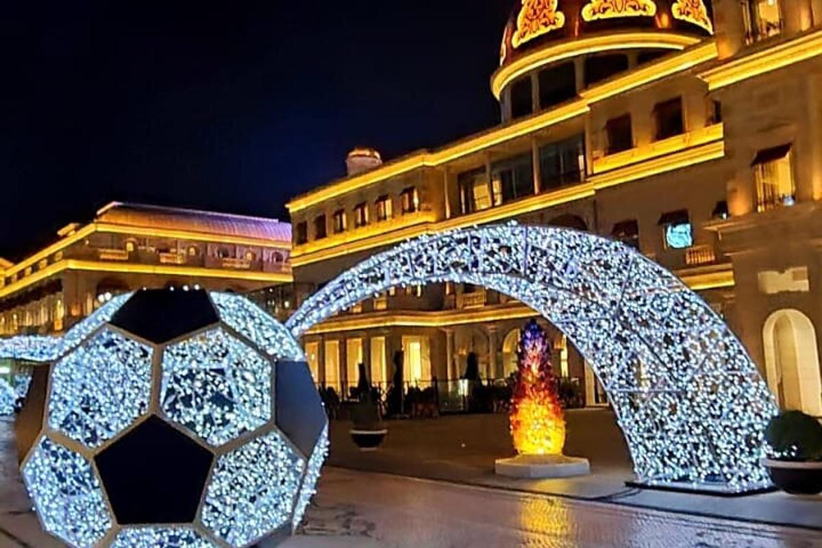 a building decorated with christmas lights at night