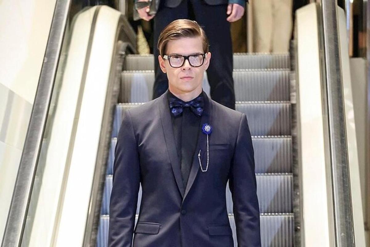 a man wearing a suit and a bow tie