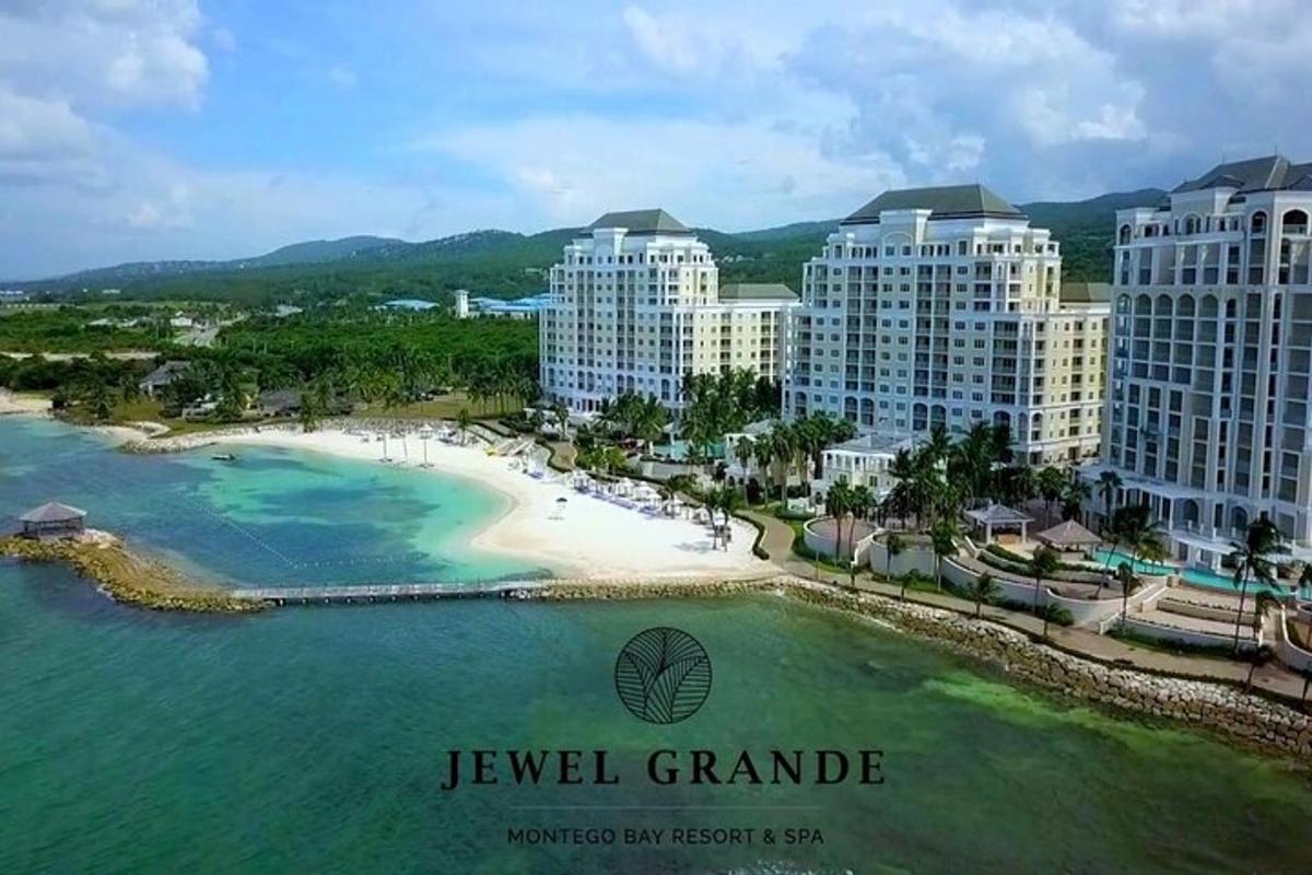 an aerial view of a beach and some buildings